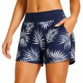 Pantaloncini da bagno donna L in tessuto elasticizzato blu navy con stampa foglie e tasche